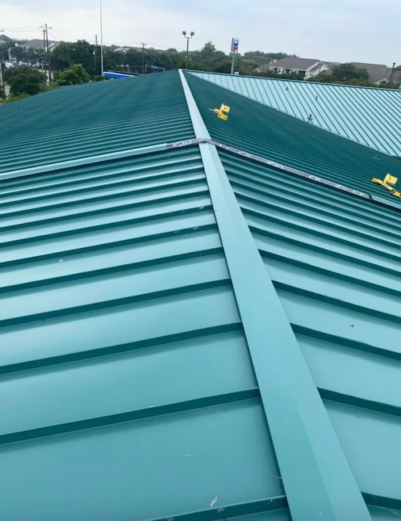 Green commercial metal roof ridge and valley for Metal Roof Repair in Darien