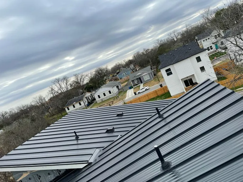 Standing seam metal roof panels with vents for Skylight Repair in Darien